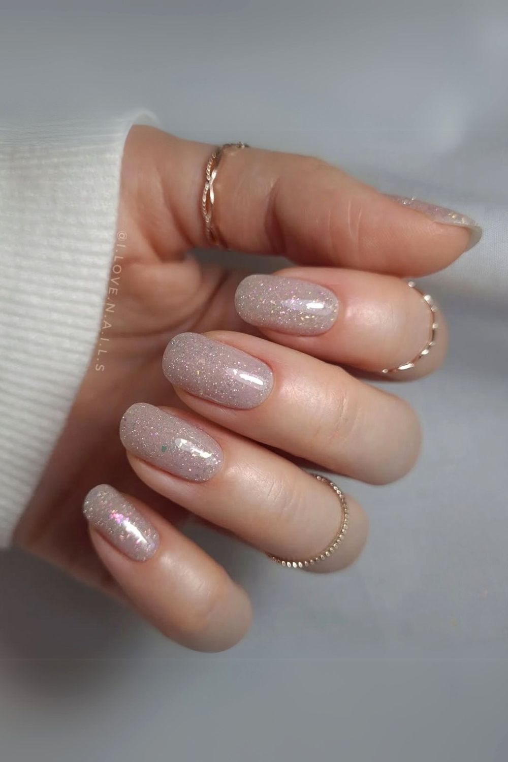 Neutral nails topped with glitter