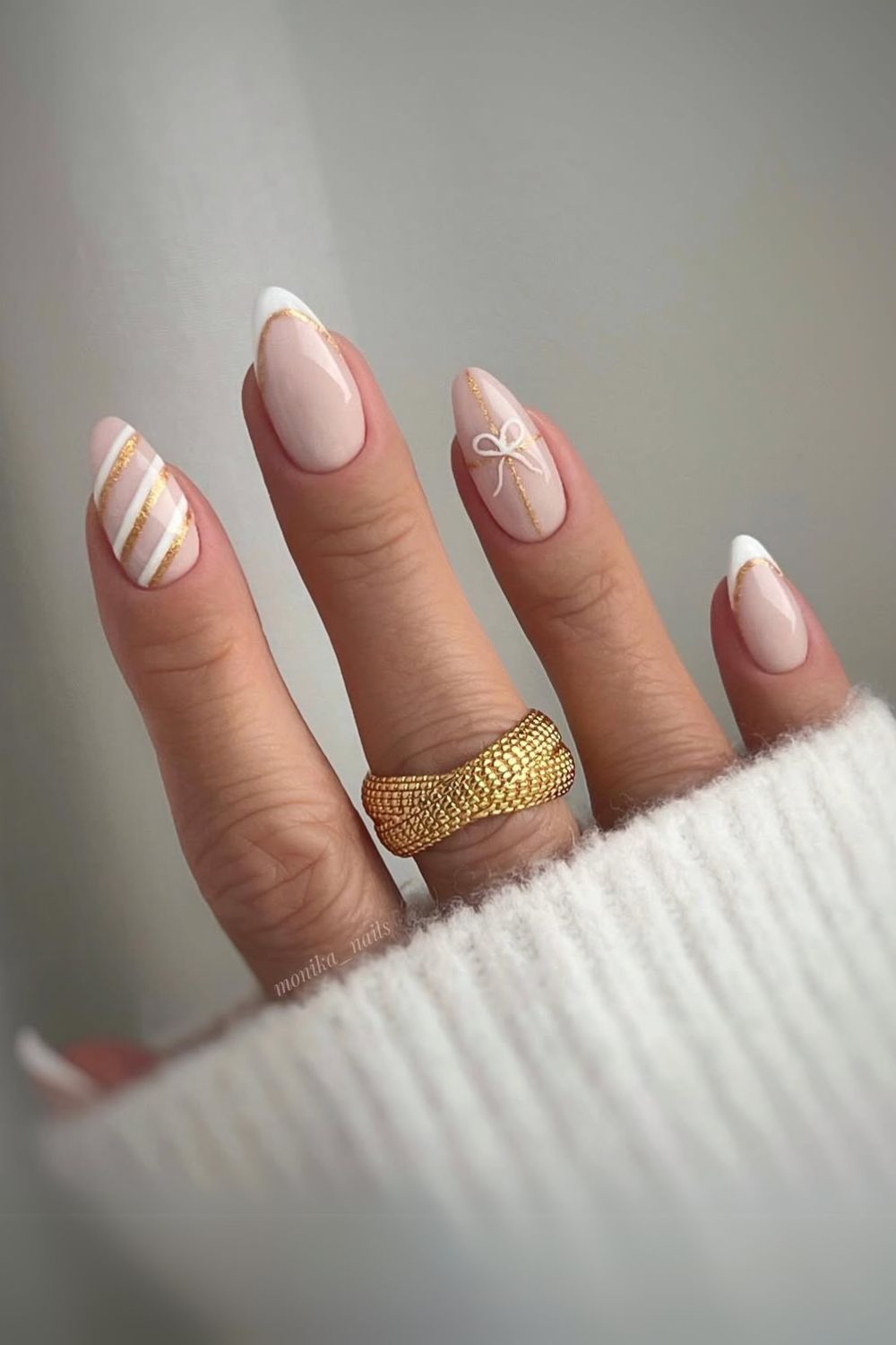 Neutral nails with white and gold accents