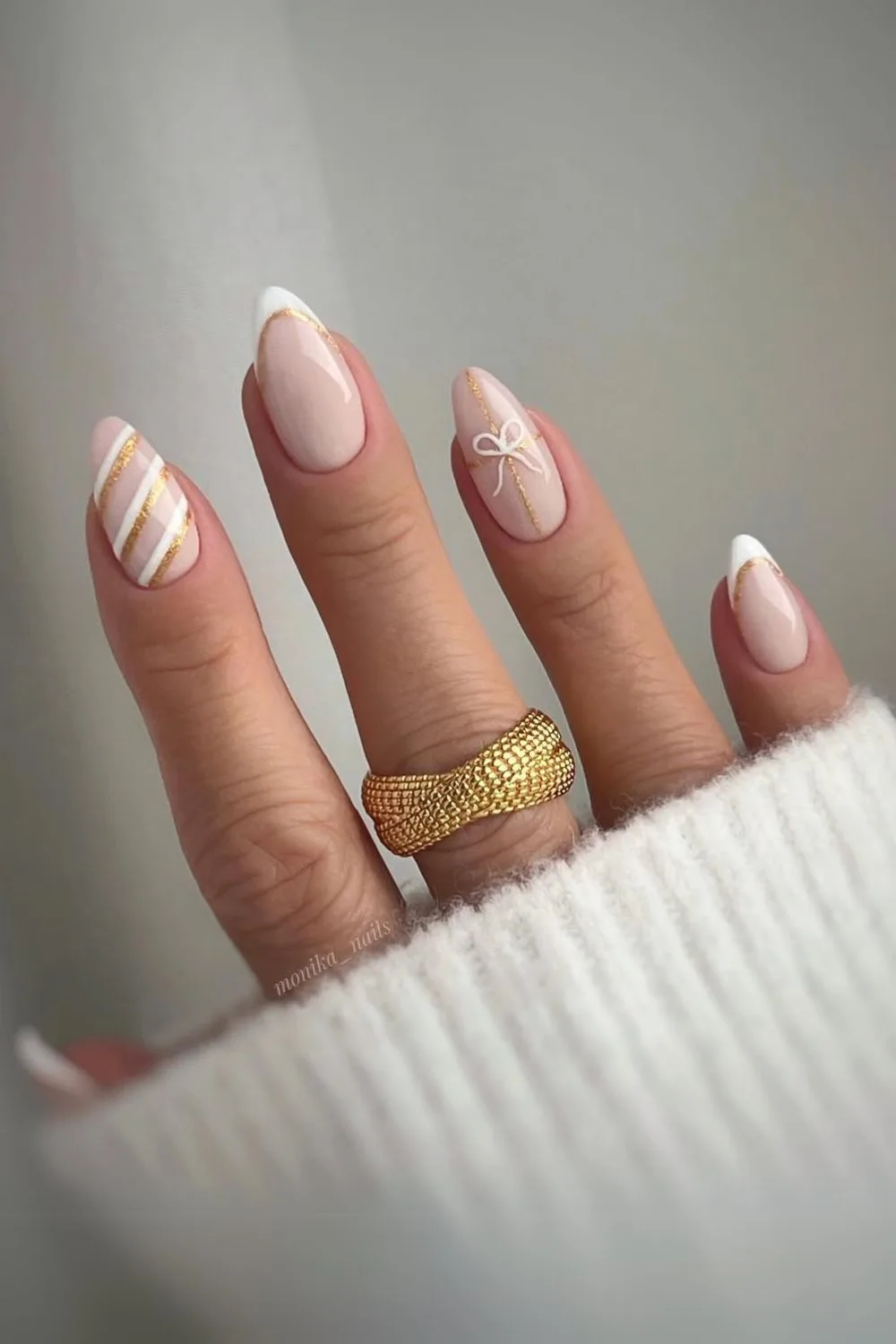 Neutral nails with white and gold accents