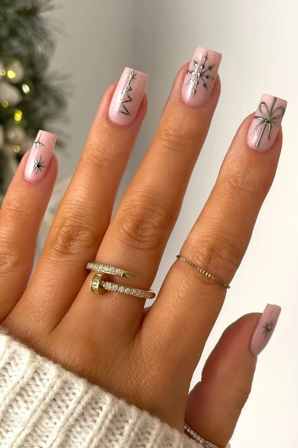 Nude base with silver chrome Christmas nail art