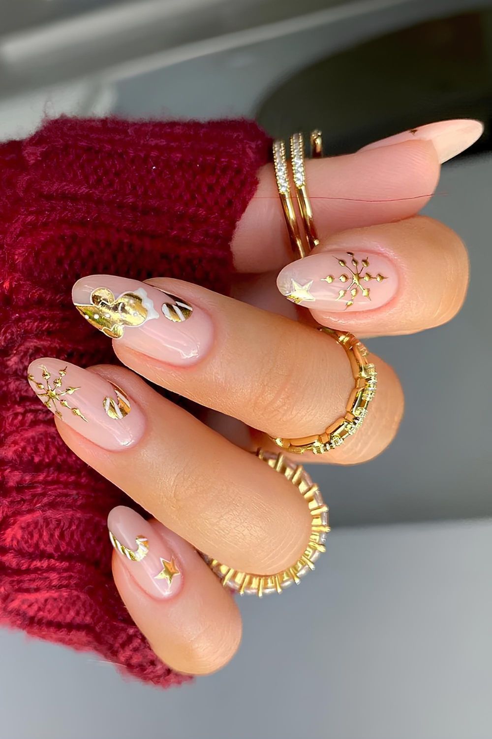 Nude nails with gold gingerbread cookie and gold snowflakes