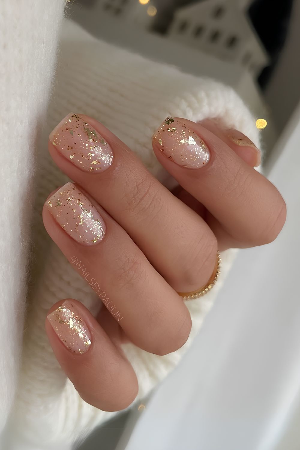 Nude nails with gold glitter accent