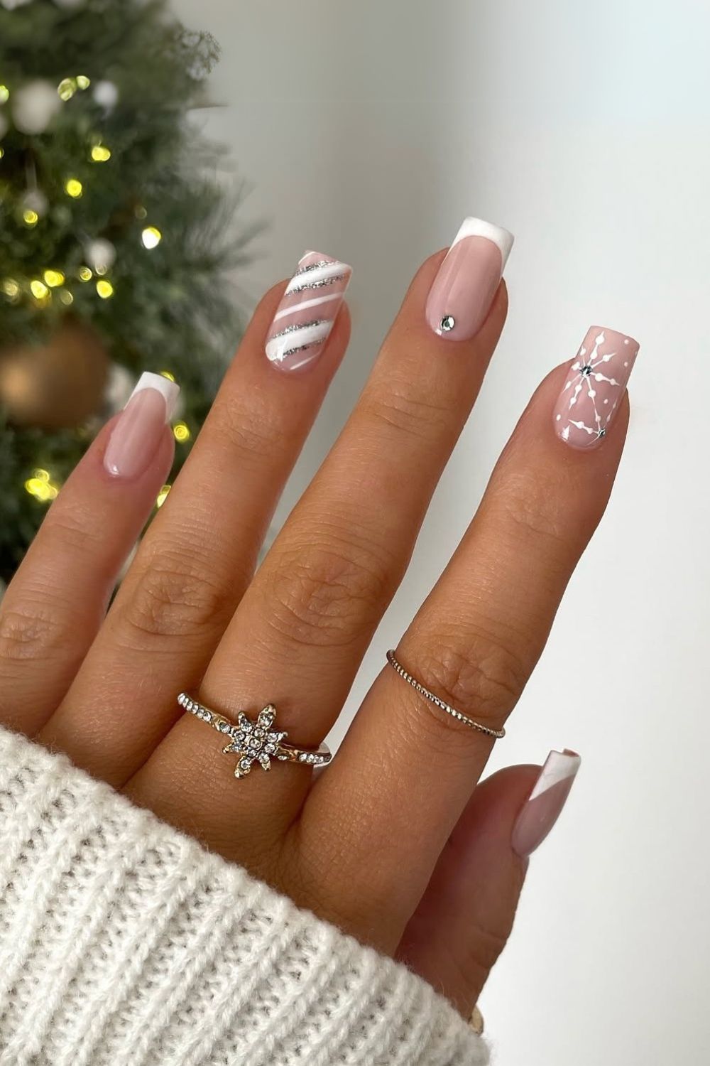 Nude nails with white and silver Christmas art