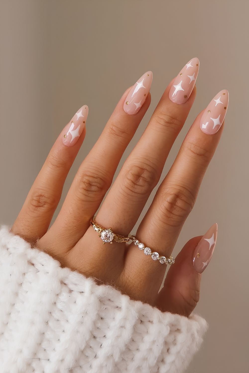 Nude nails with white starburst art