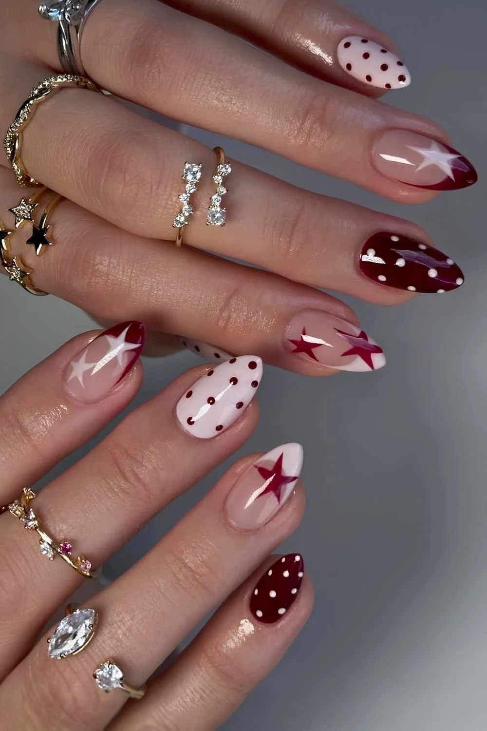Pink and burgundy nails with stars and dots