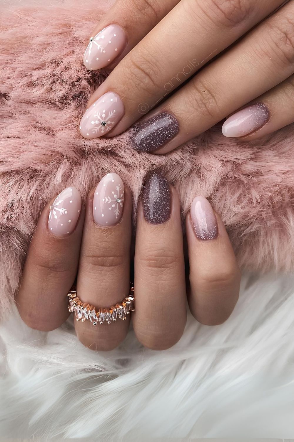 Pink and mauve nails with snowflakes