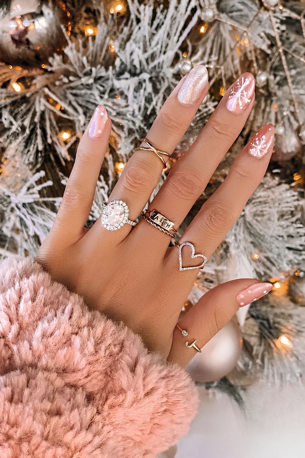 Pink chrome nails with snowflakes