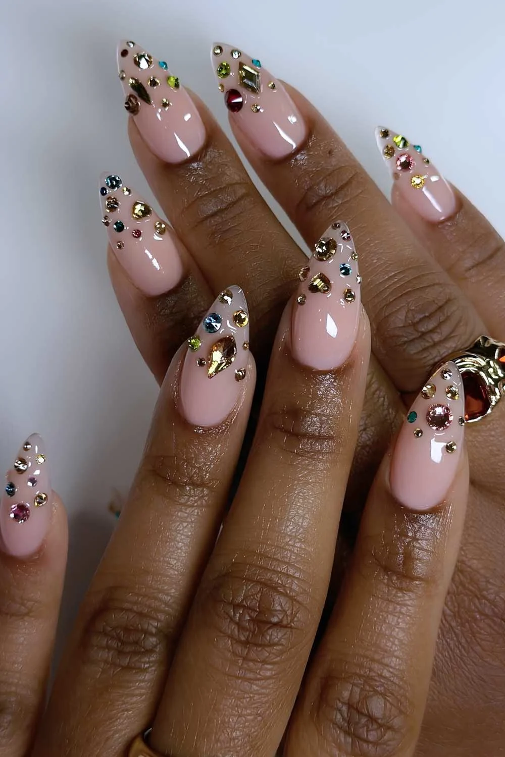 Pink mani with chunky rhinestone accents