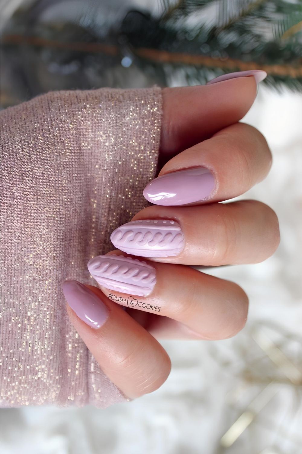 Pink nails with sweater pattern accents