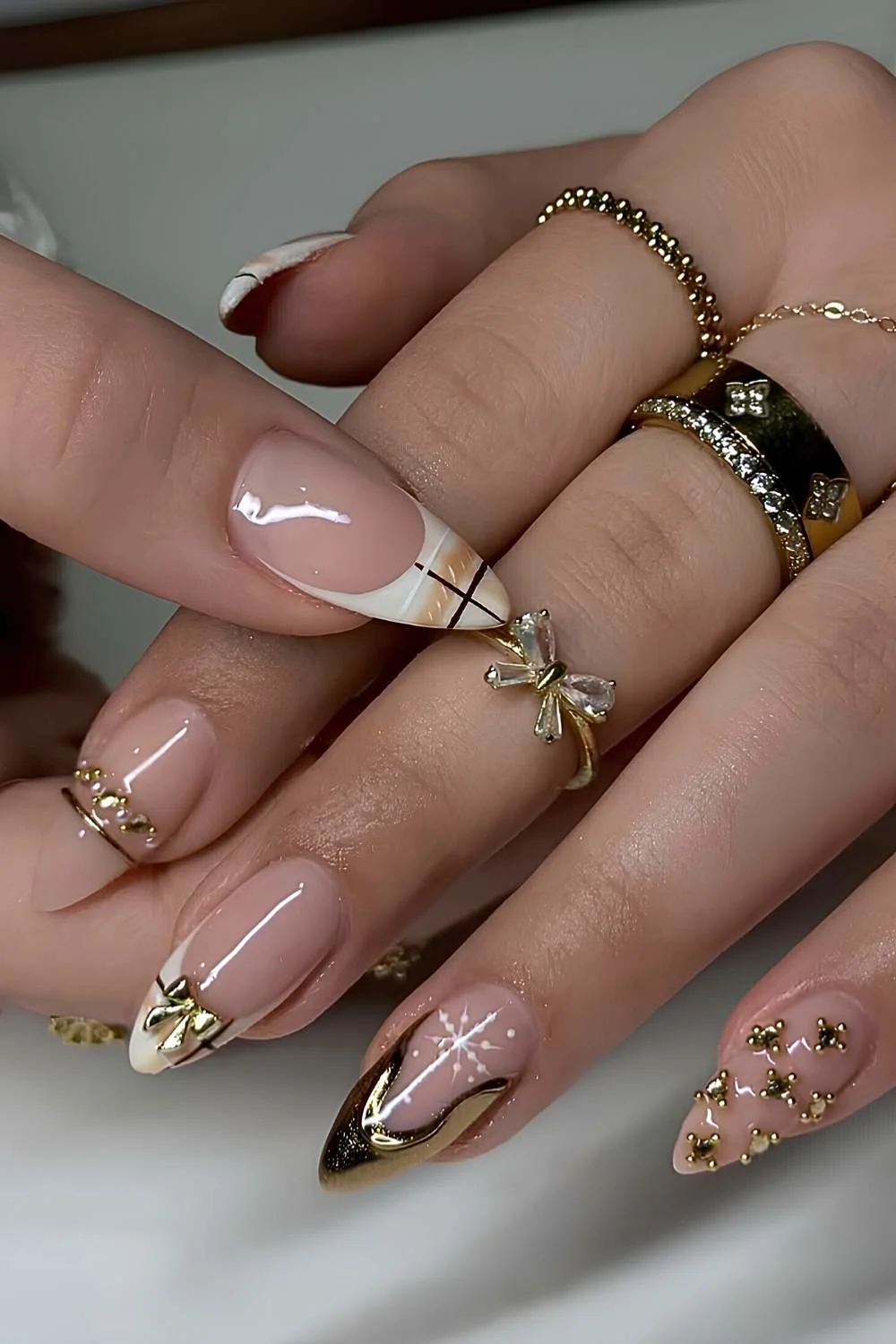 Plaid and gold French mani with bows