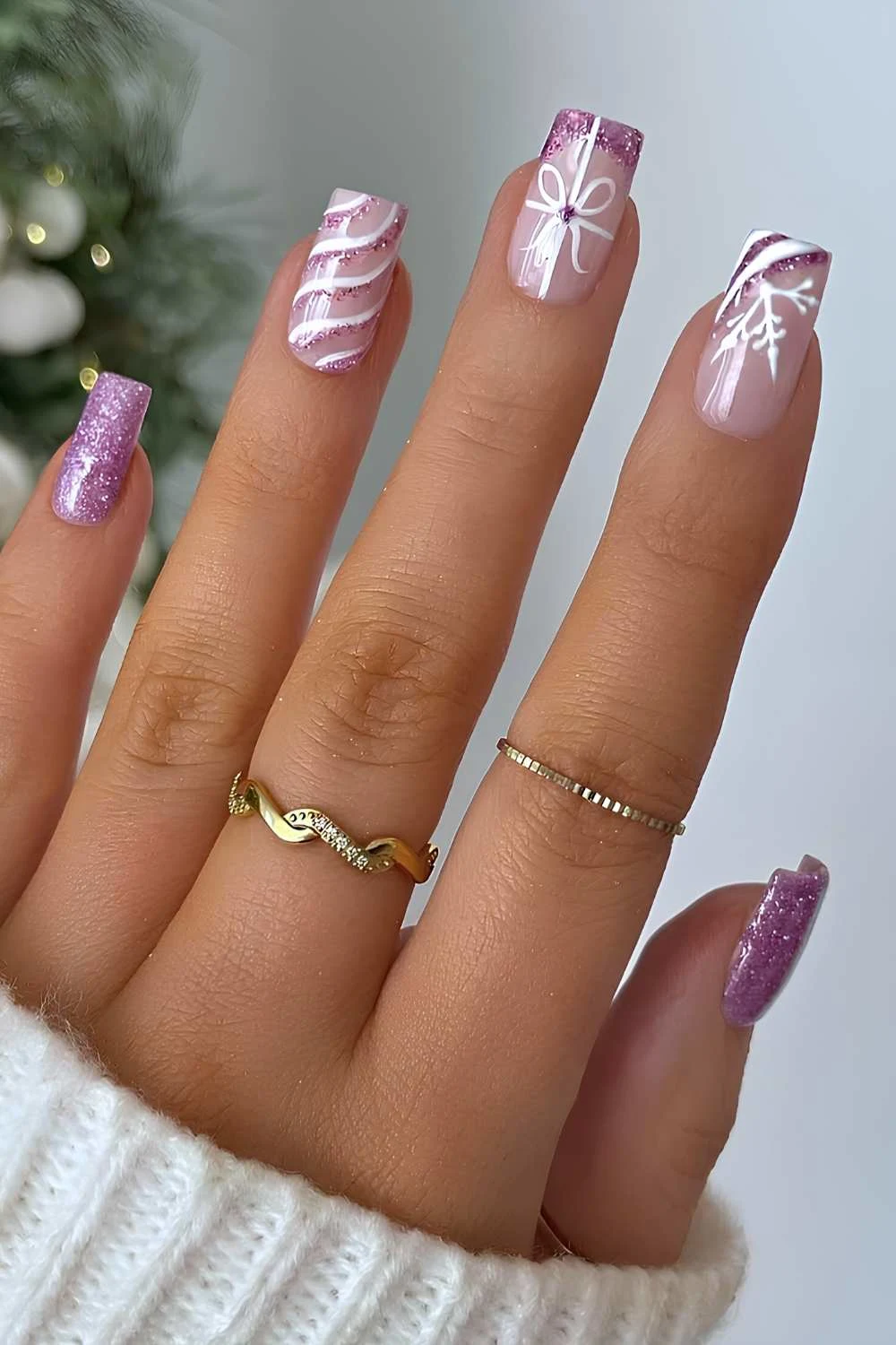 Purple glitter nails with Christmas motifs
