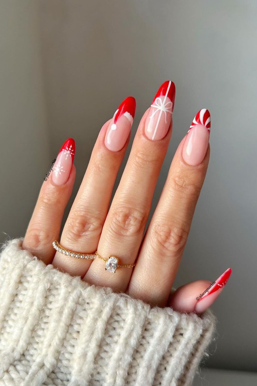 Red Christmas French tip nails with candy canes and bows