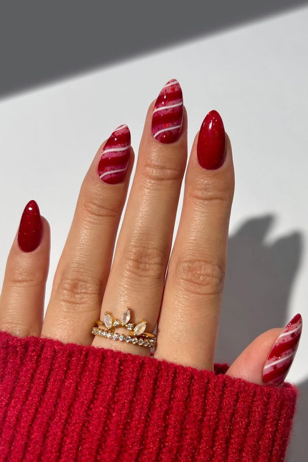 Red Christmas nails with white stripes