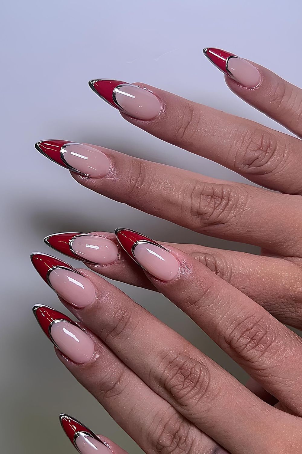 Red French nails with chrome outline