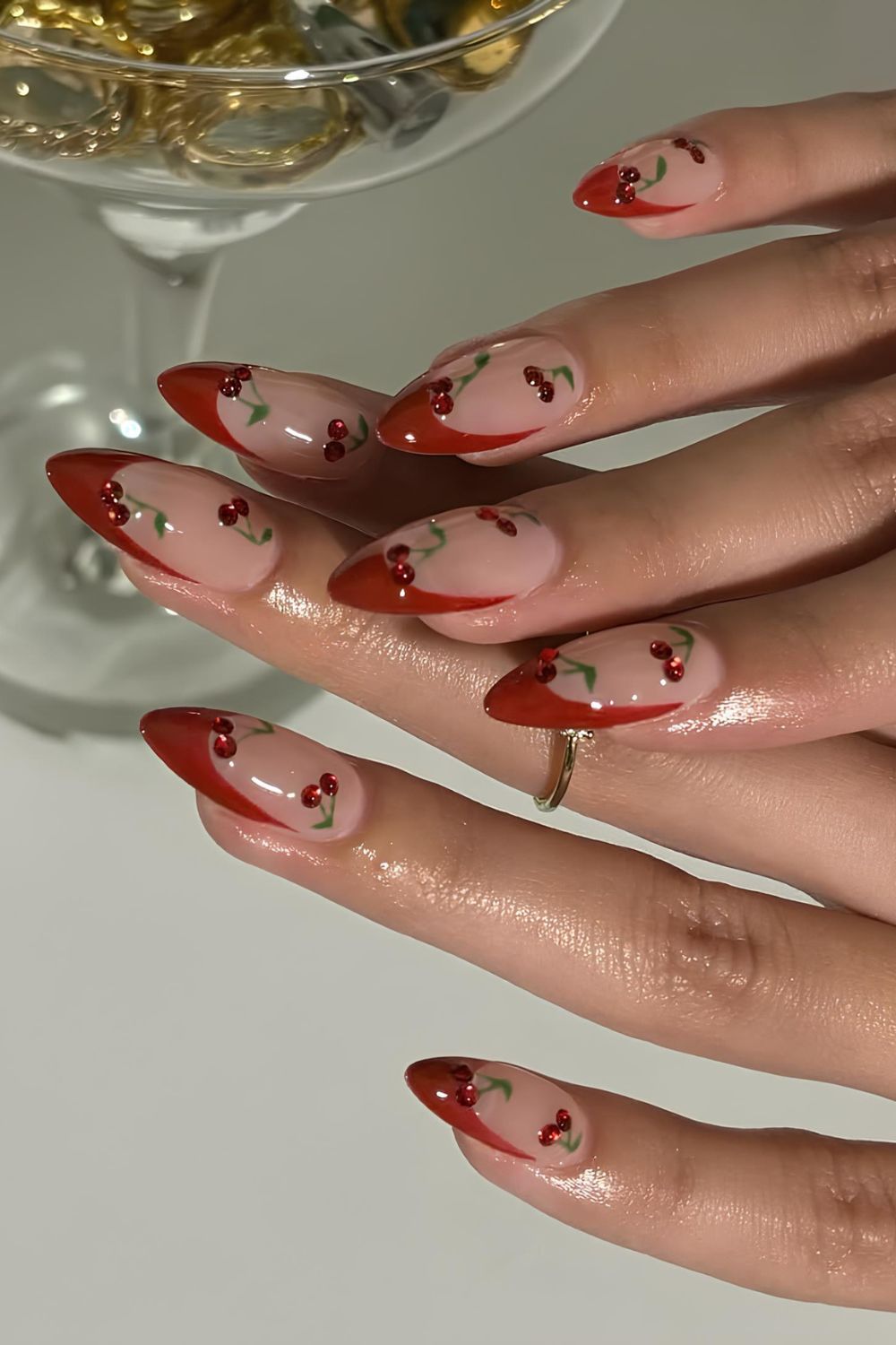 Red French nails with rhinestine cherry accents