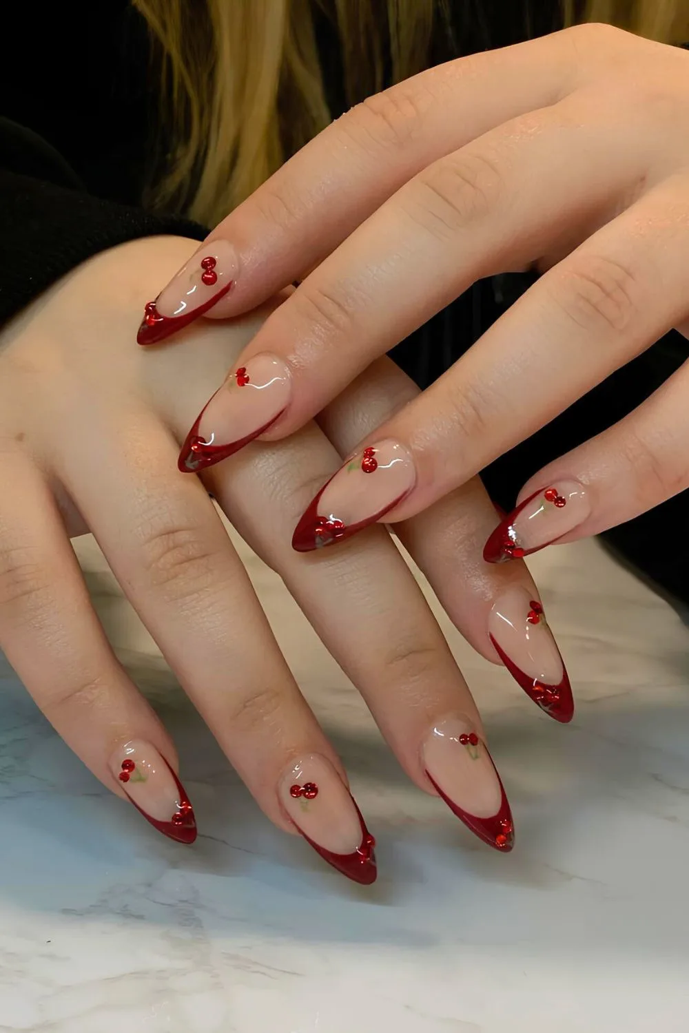 Red French nails with rhinestone cherries