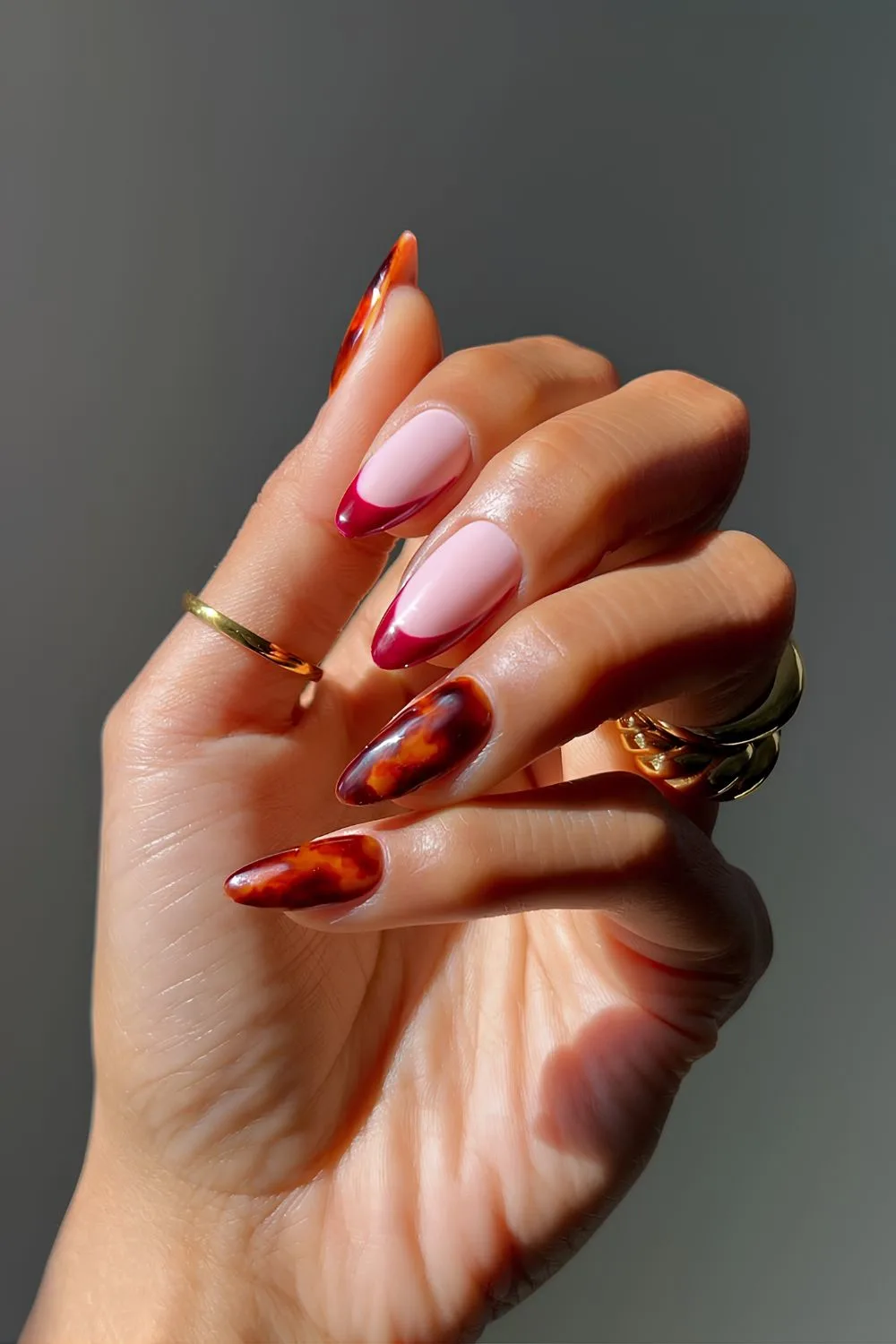 Red French nails with tortoise shell accent