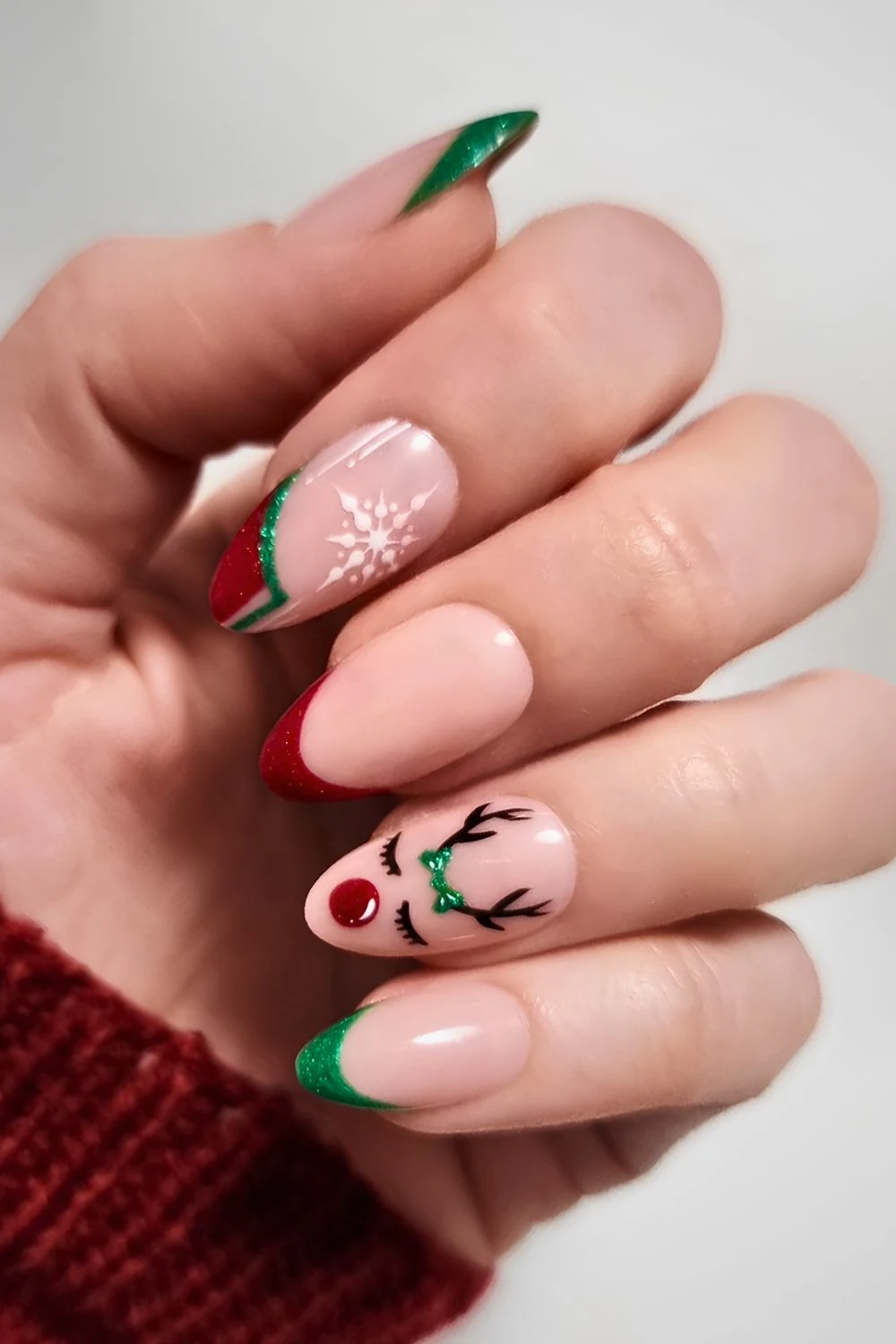 Red and green Christmas nails with Rudolph art