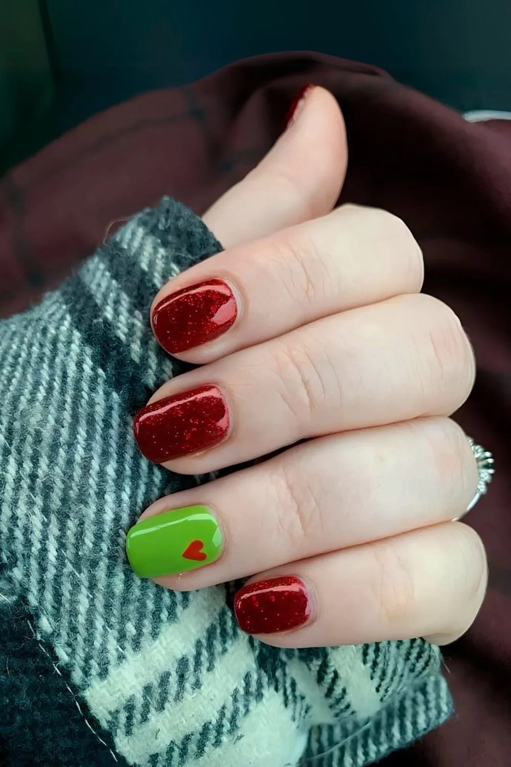 Red and green Grinch-inspired nails