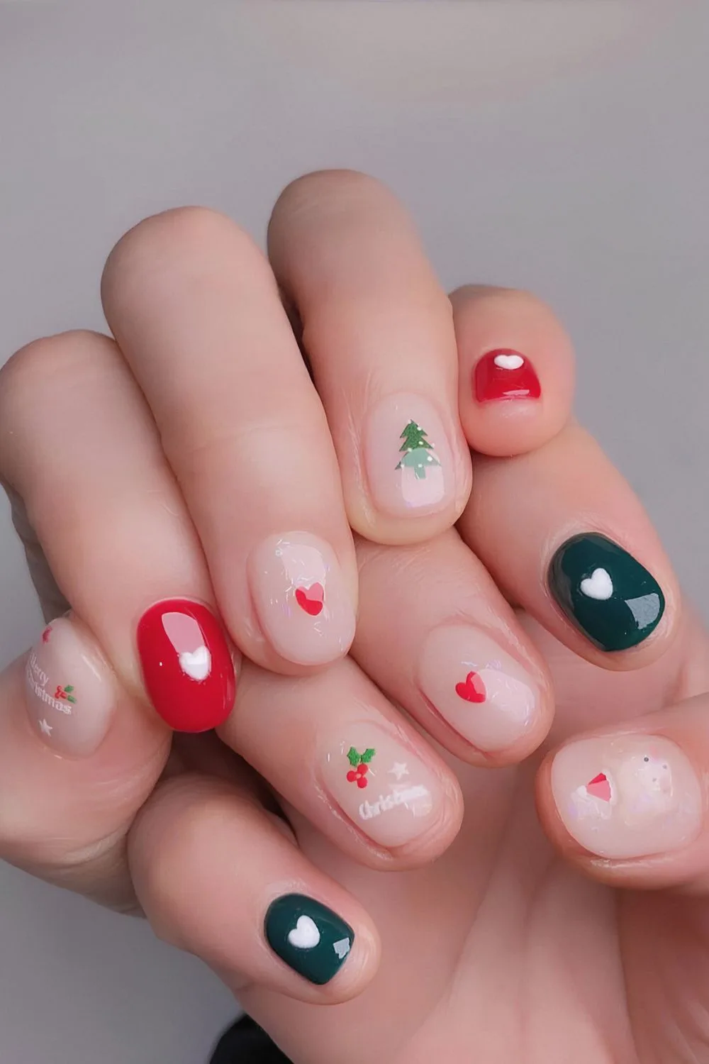 Red and green nails with heart and christmas tree art