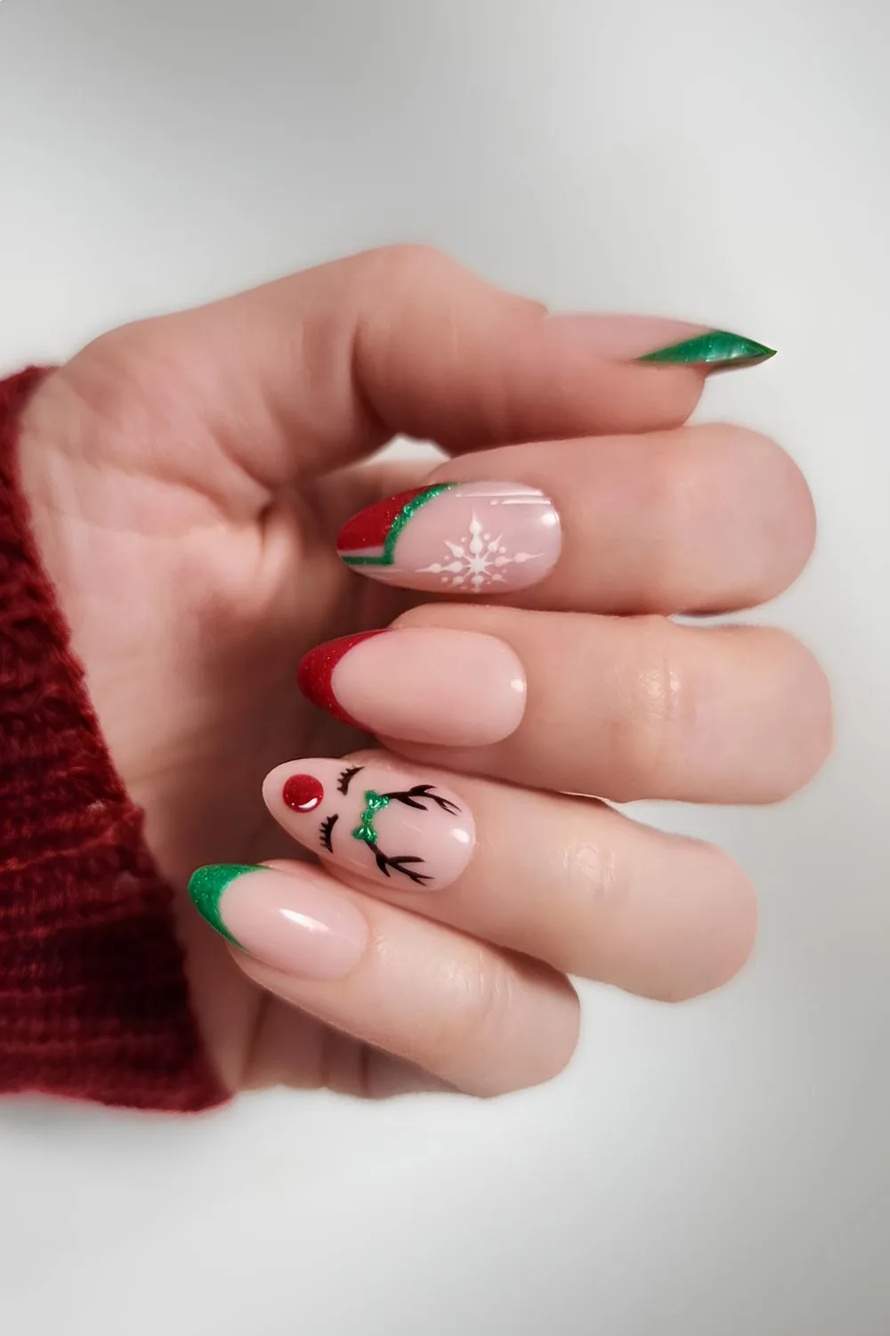 Red and green nails with reindeer art