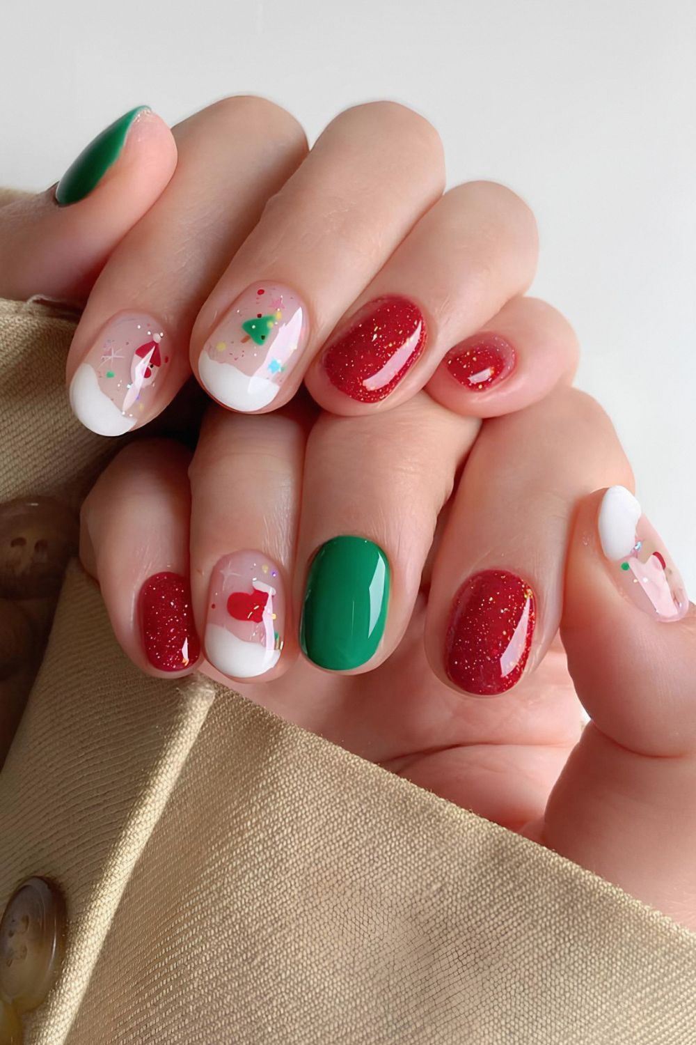 Red and green nails with snow art accents