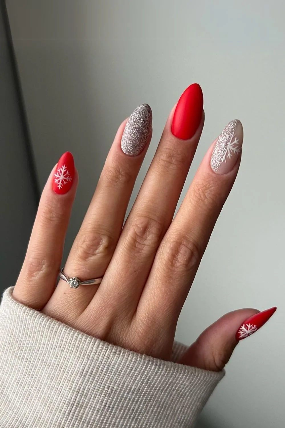 Red and silver glitter nails with snowflake art