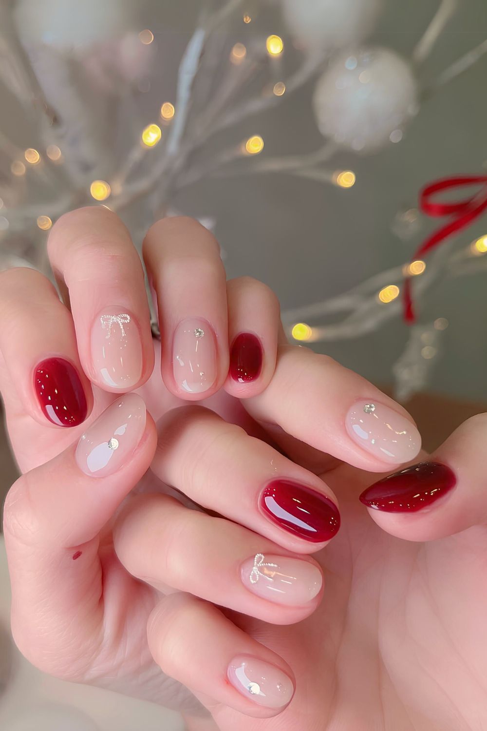 Red and white nails with 3d bows