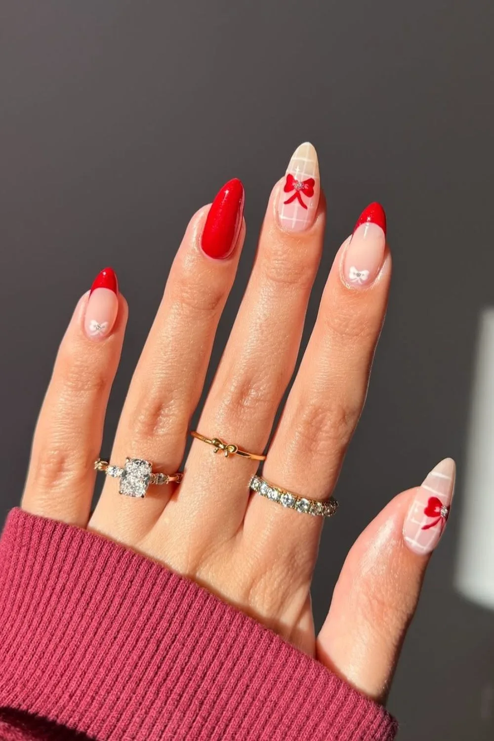 Red and white nails with plaid design and bows