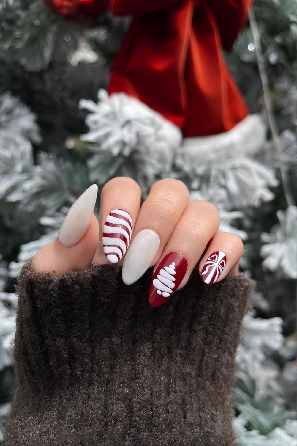 Red and white nails with white Christmas tree accent