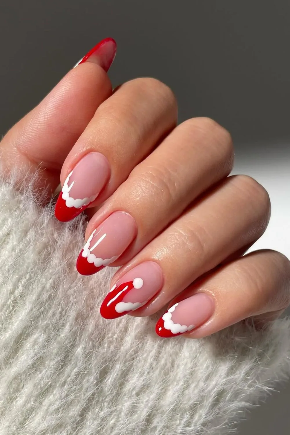 Red and white snowy French tip nails with Santa's hat