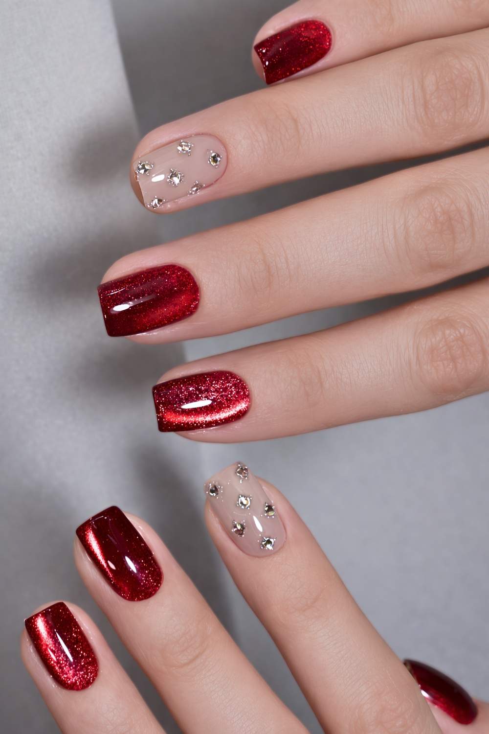 Red cat eye nails with gems