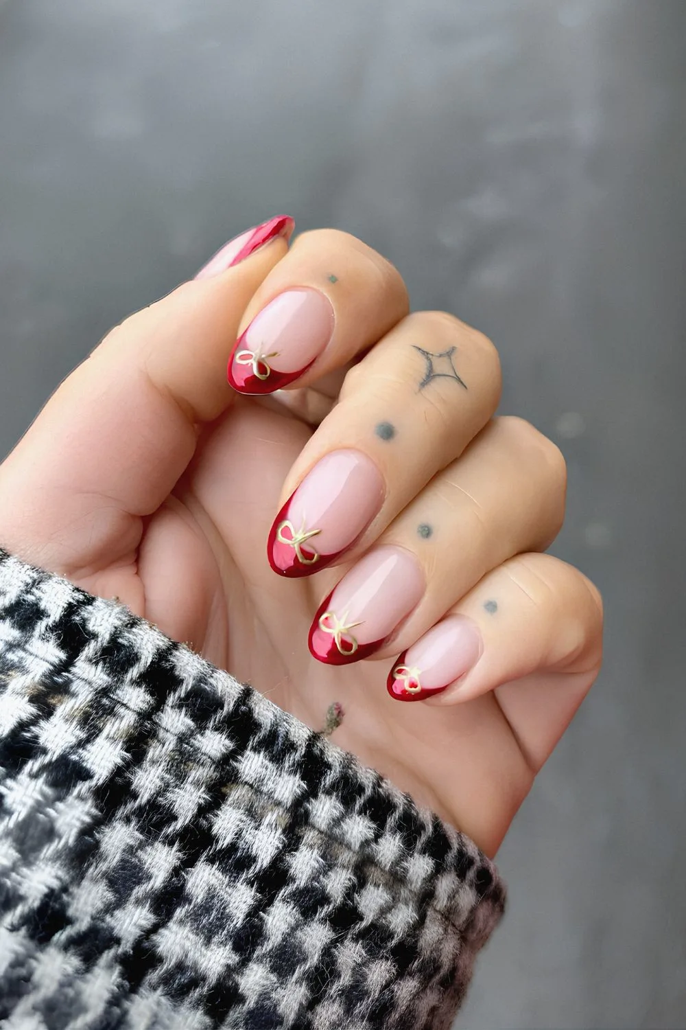 Red chrome French nails with bows