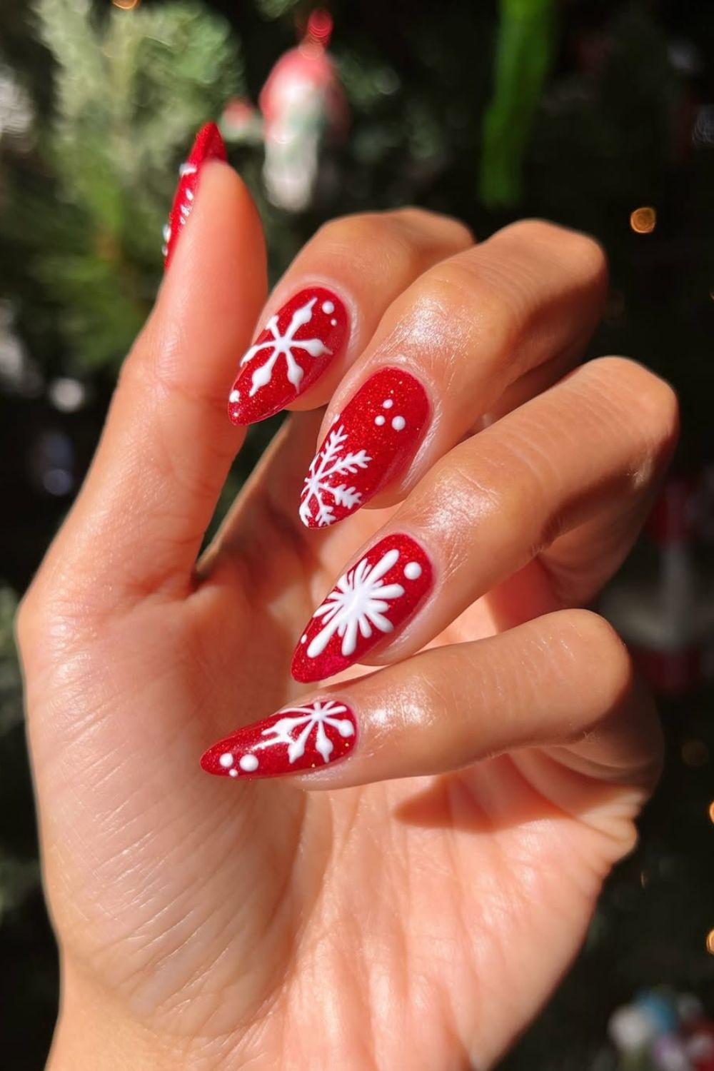 Red glitter nails with snowflakes