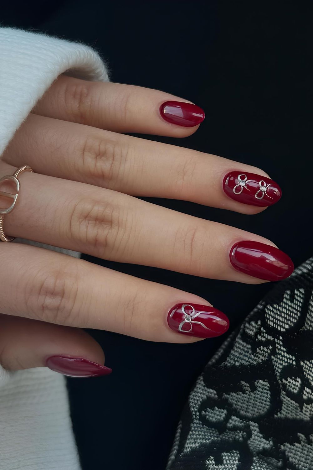 Red mani with silver chrome bows