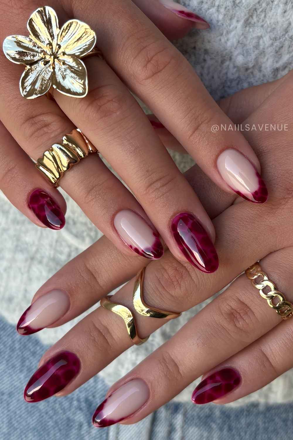 Red nails with blooming gel animal print