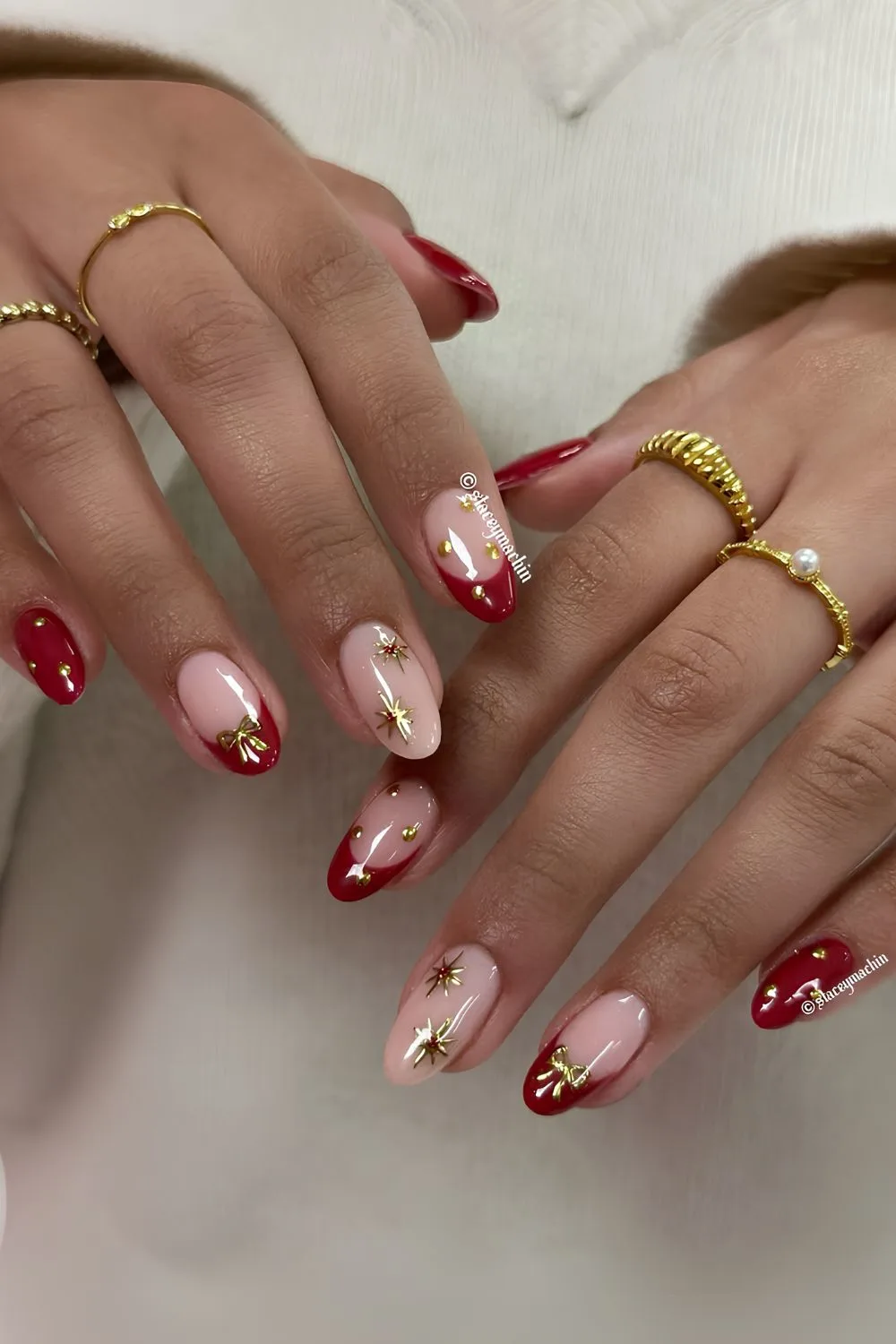 Red nails with gold chrome accents