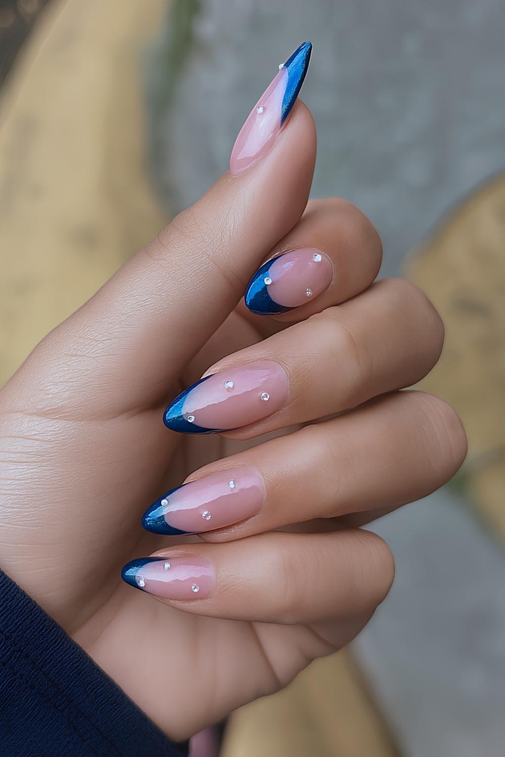 Sapphire blue French nails with accent rhinestones