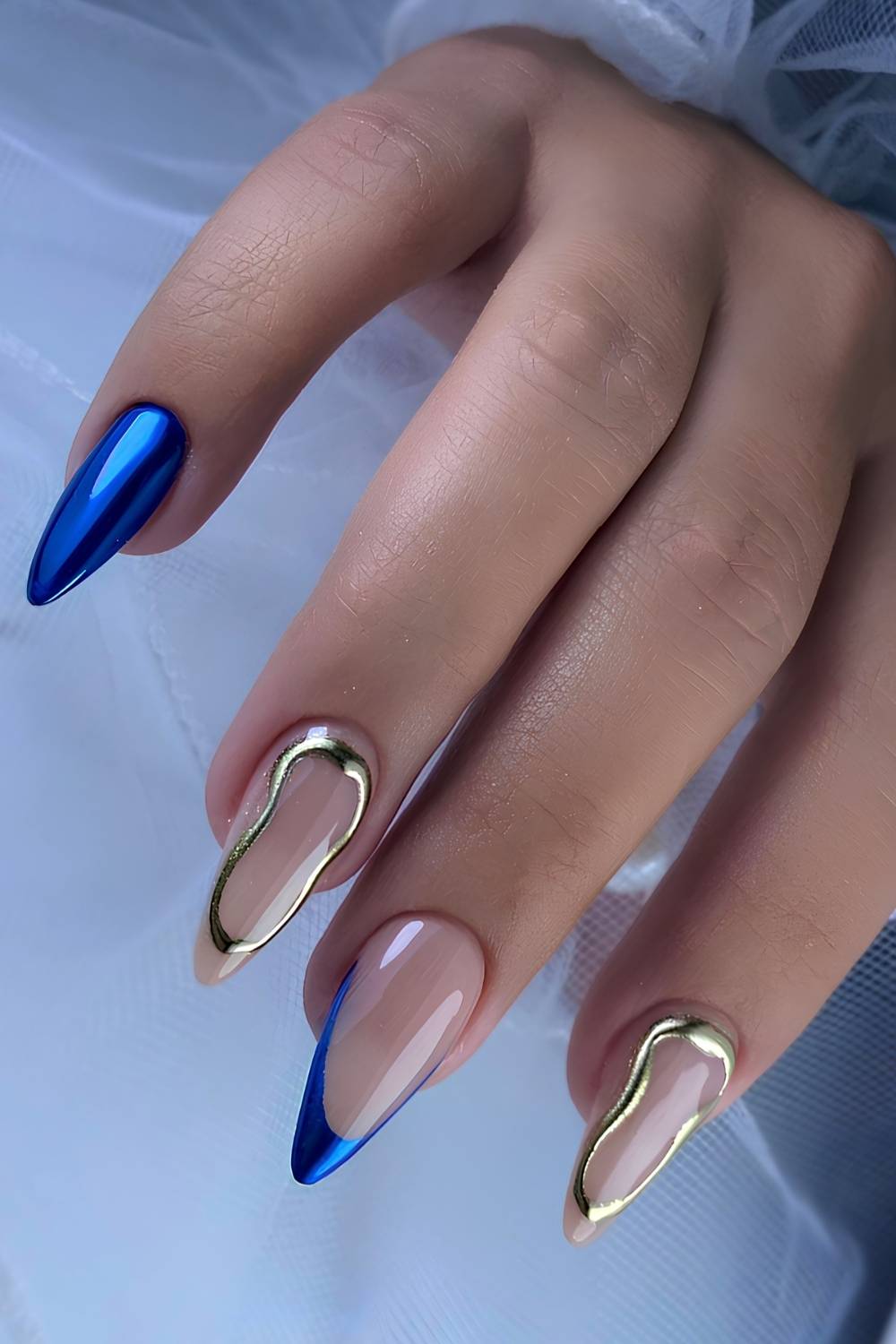 Sapphire blue chrome mani with gold chrome accents