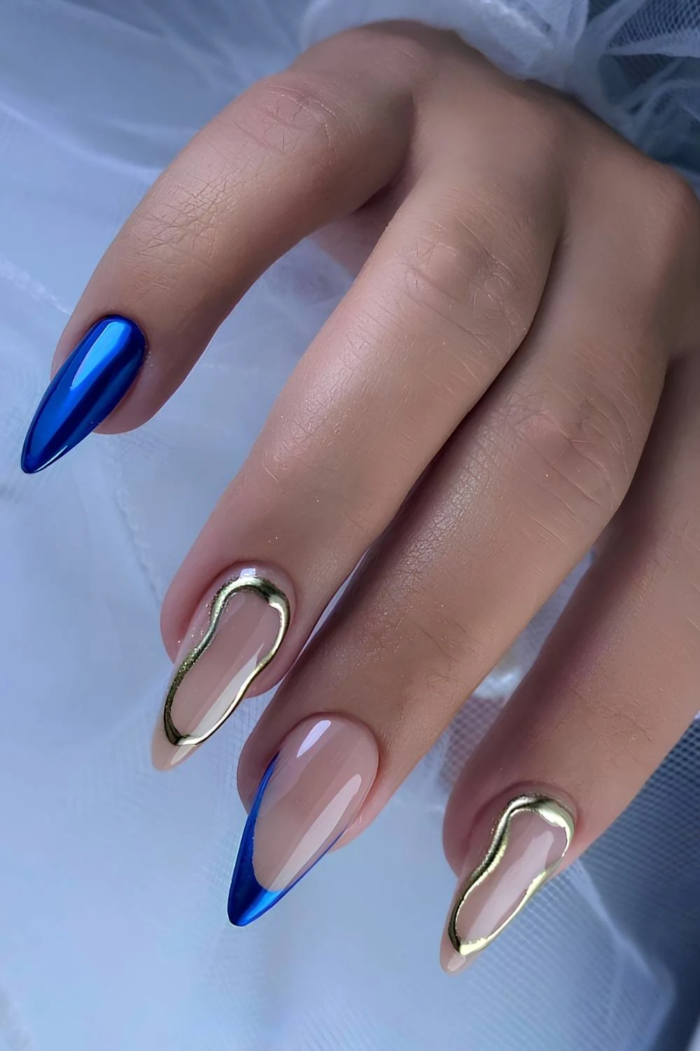 Sapphire blue chrome mani with gold chrome accents