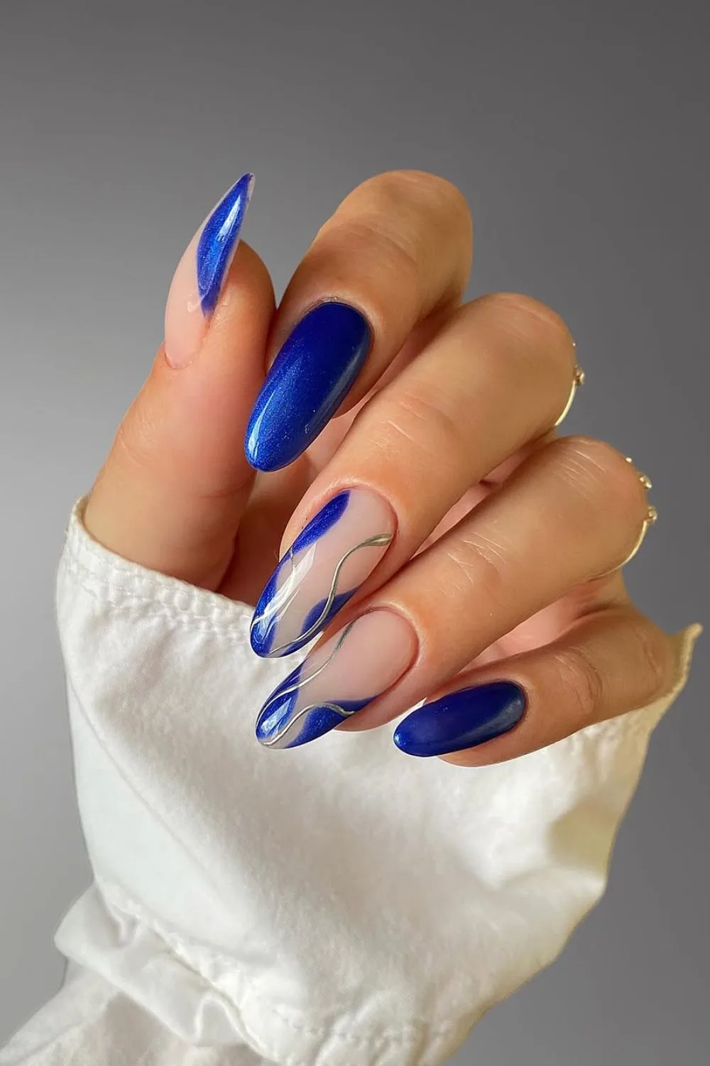 Sapphire blue nails with swirls