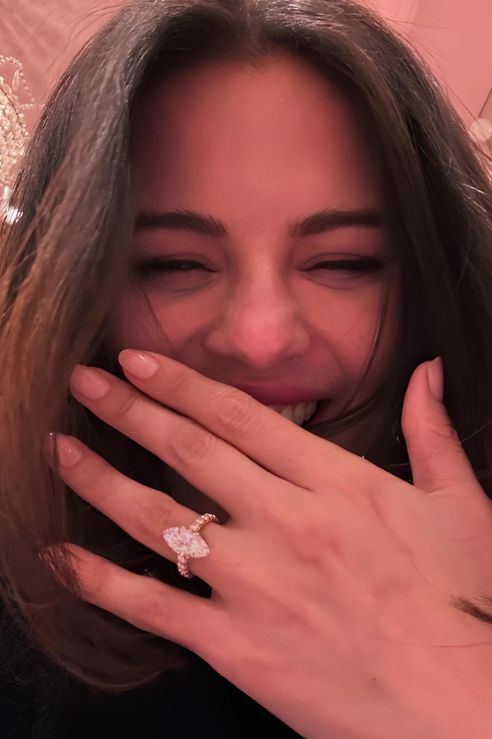 Selena Gomez showing her hands and engagement ring and manicure