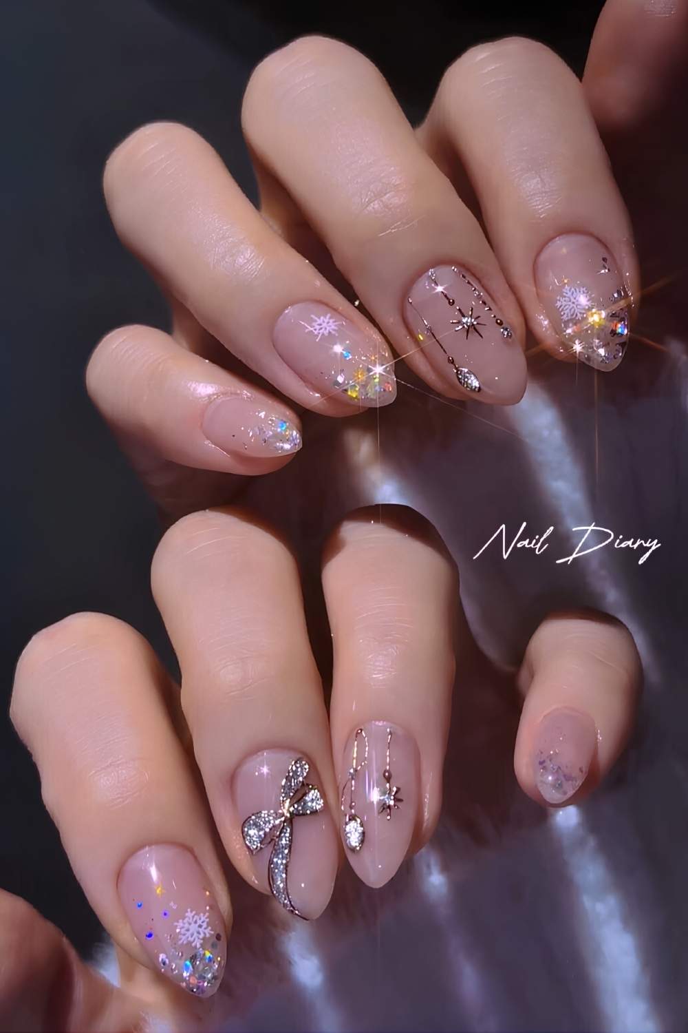 Sheer Christmas nails with glitter and bows