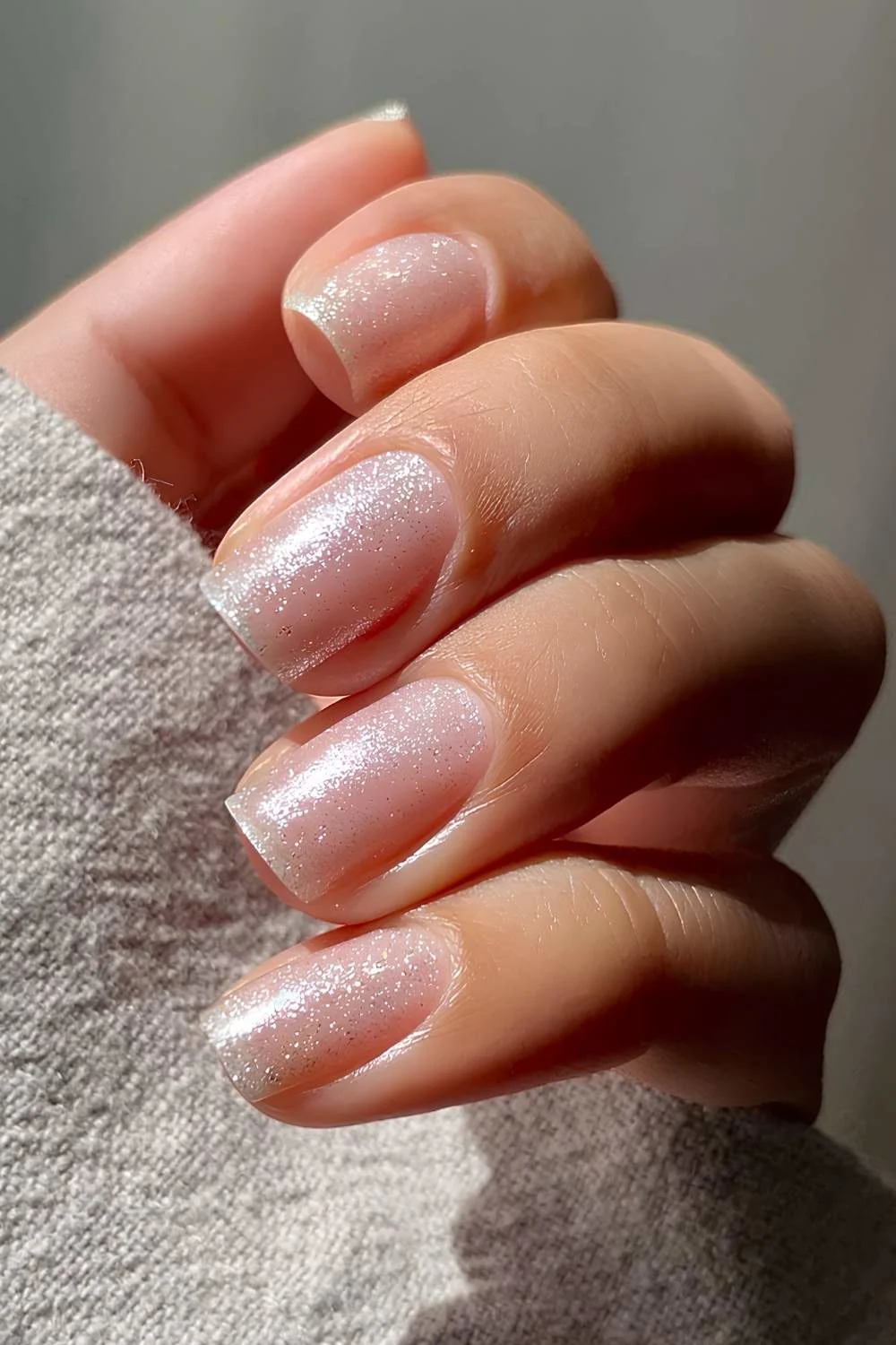 Sheer glittery manicure