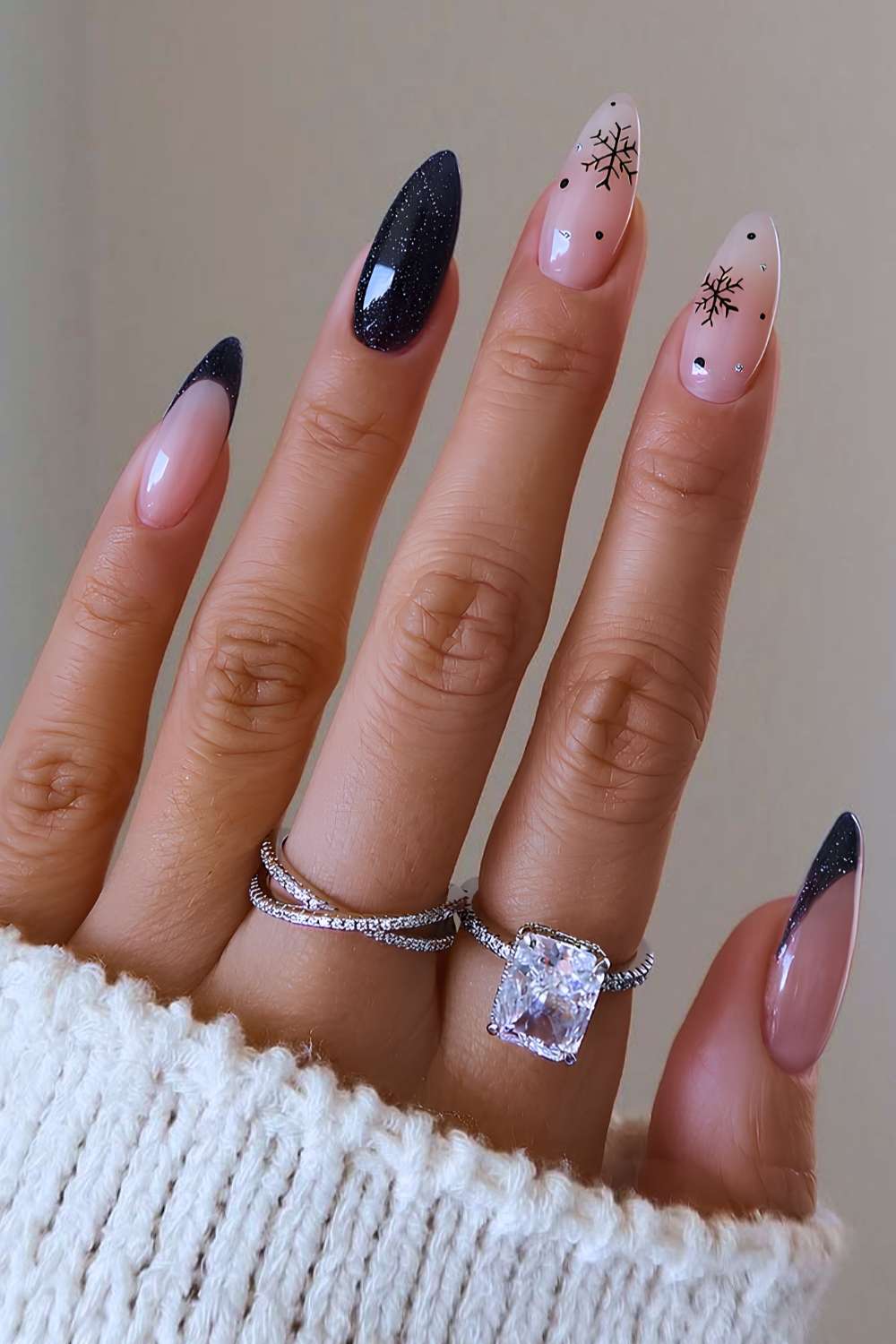 Shimmery black mani with snowflakes and micro dots