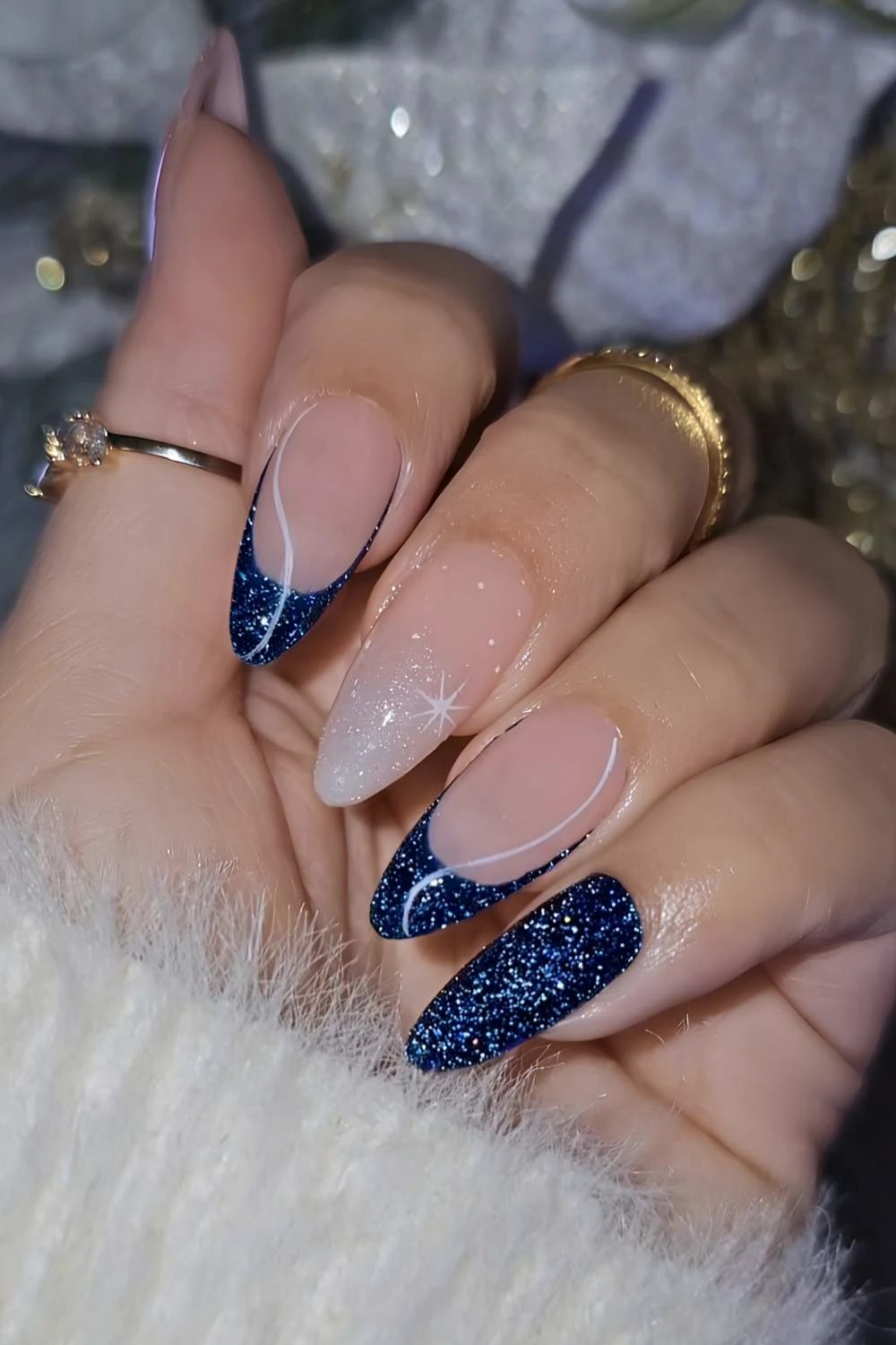 Shimmery dark blue nails with white line art