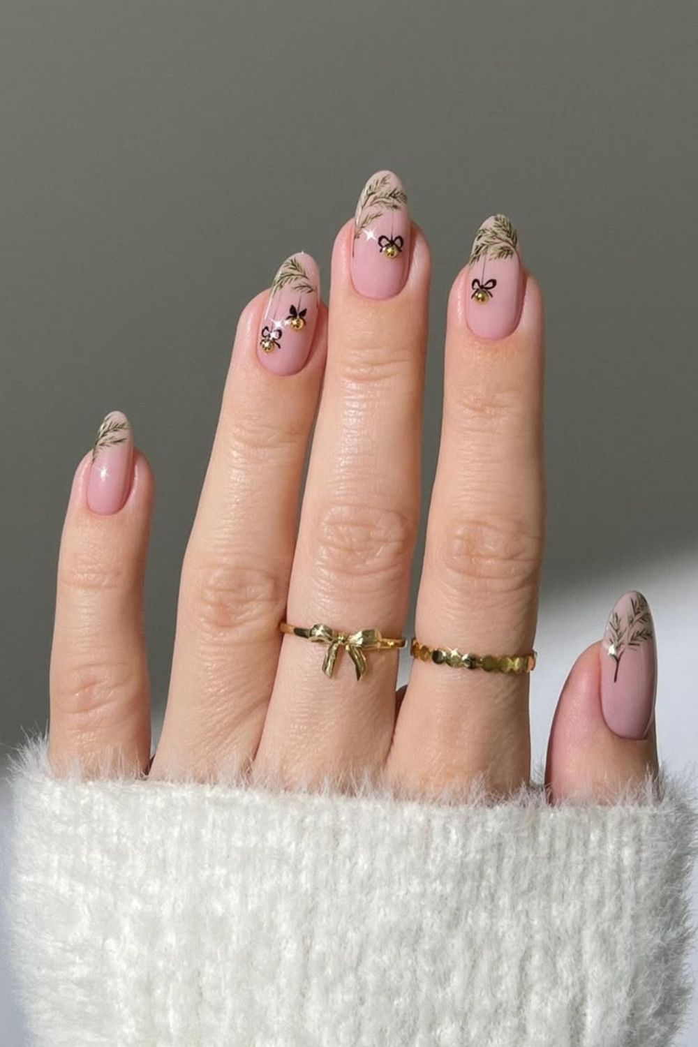 Shimmery gold tips designed like a Christmas tree branch with Christmas bauble details