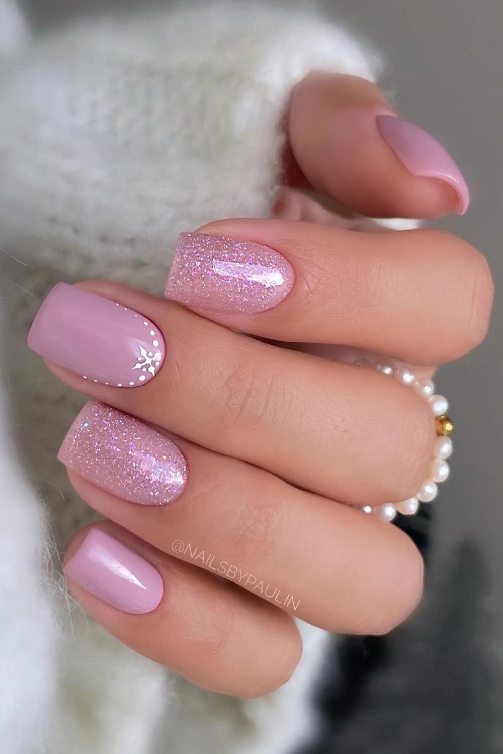 Short pink glitter mani with snowflakes