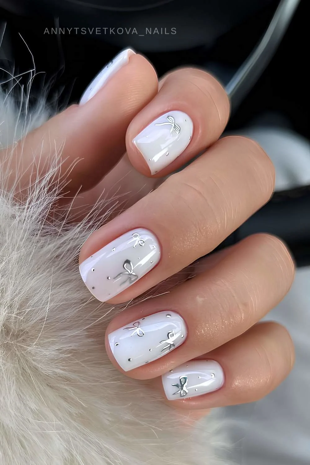 Short white nails with silver bows