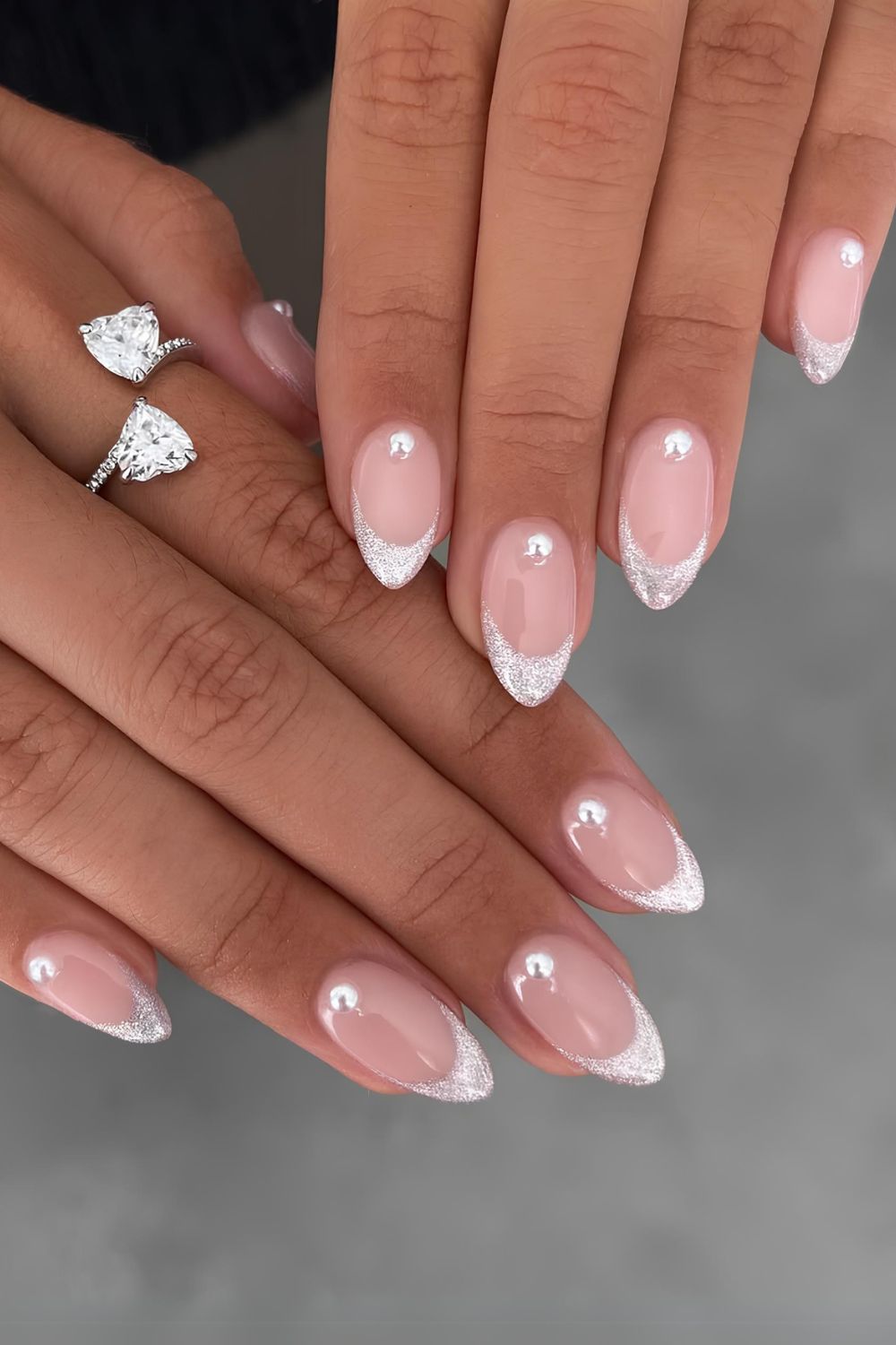 Silver glitter French nails with pearl accents